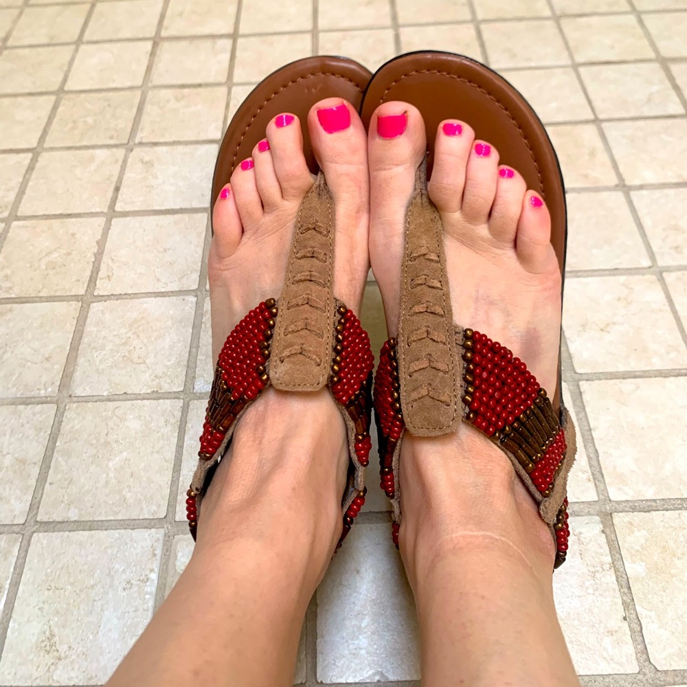 Brand new beaded suede Minnetonka thong sandals. Zipper closure.
